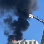 Germany: fire in a skyscraper, large column of smoke over Berlin