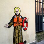 In Milan mural of Pope Francis with drowned migrant boy