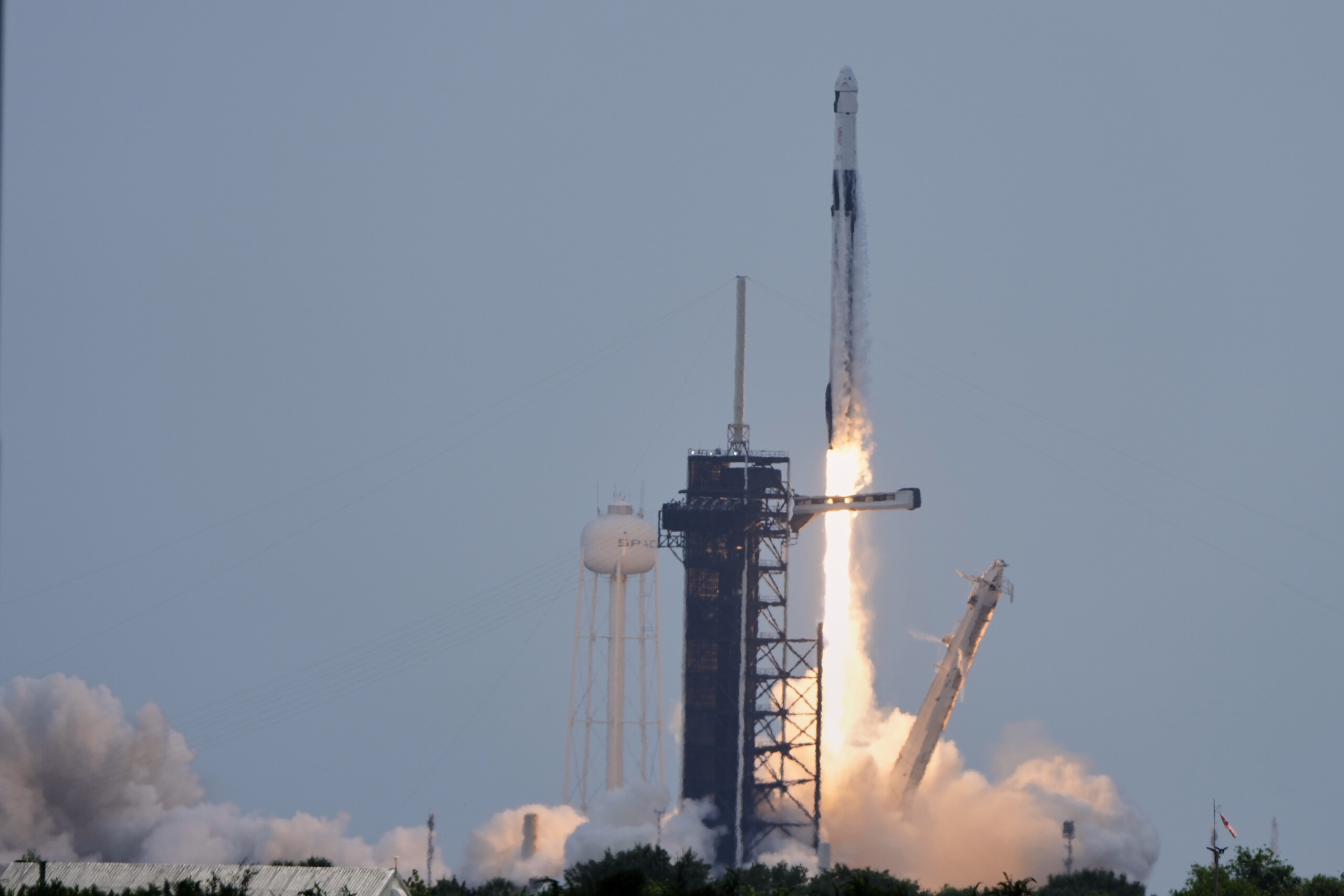 Space: Crew Dragon capsule docks with ISS, crew lands