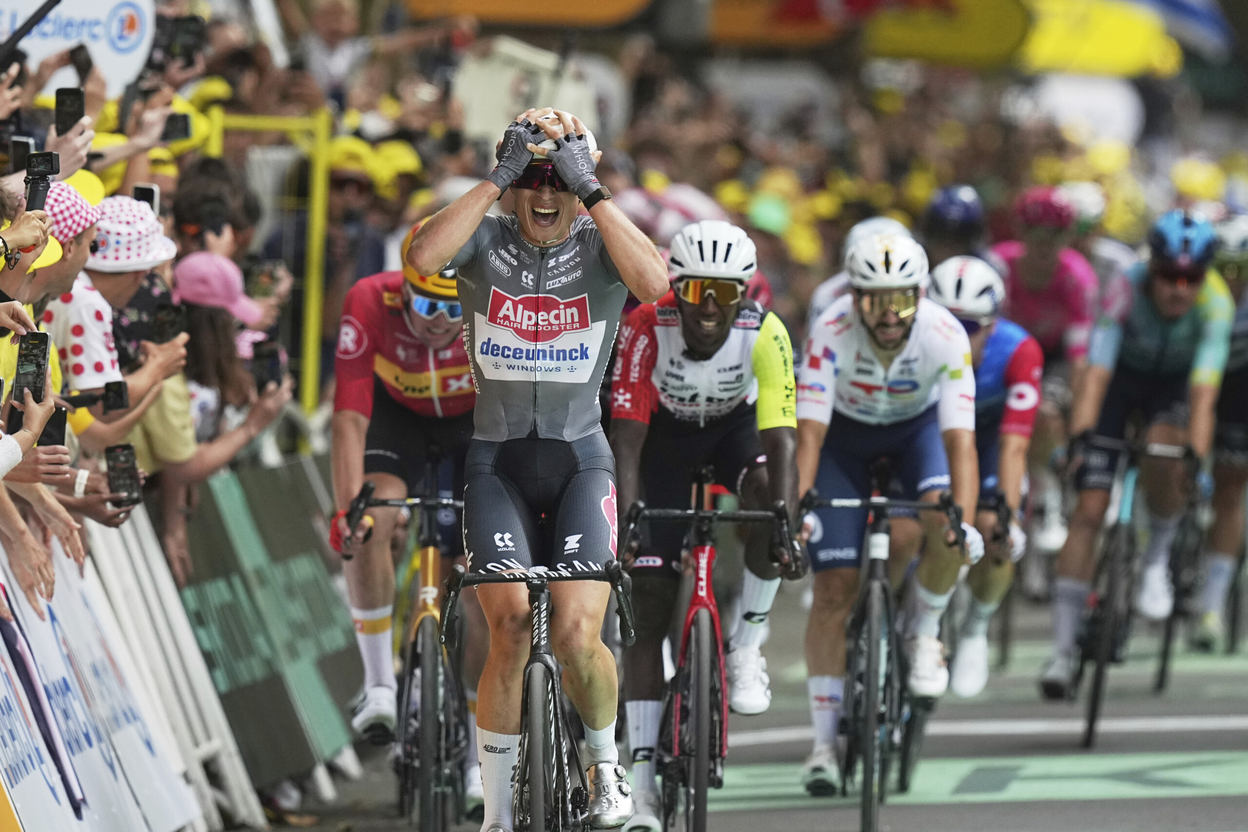 Tour de France: Philipsen wins sprint and takes first yellow jersey