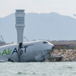 Hong Kong: cargo plane skids off runway, two dead