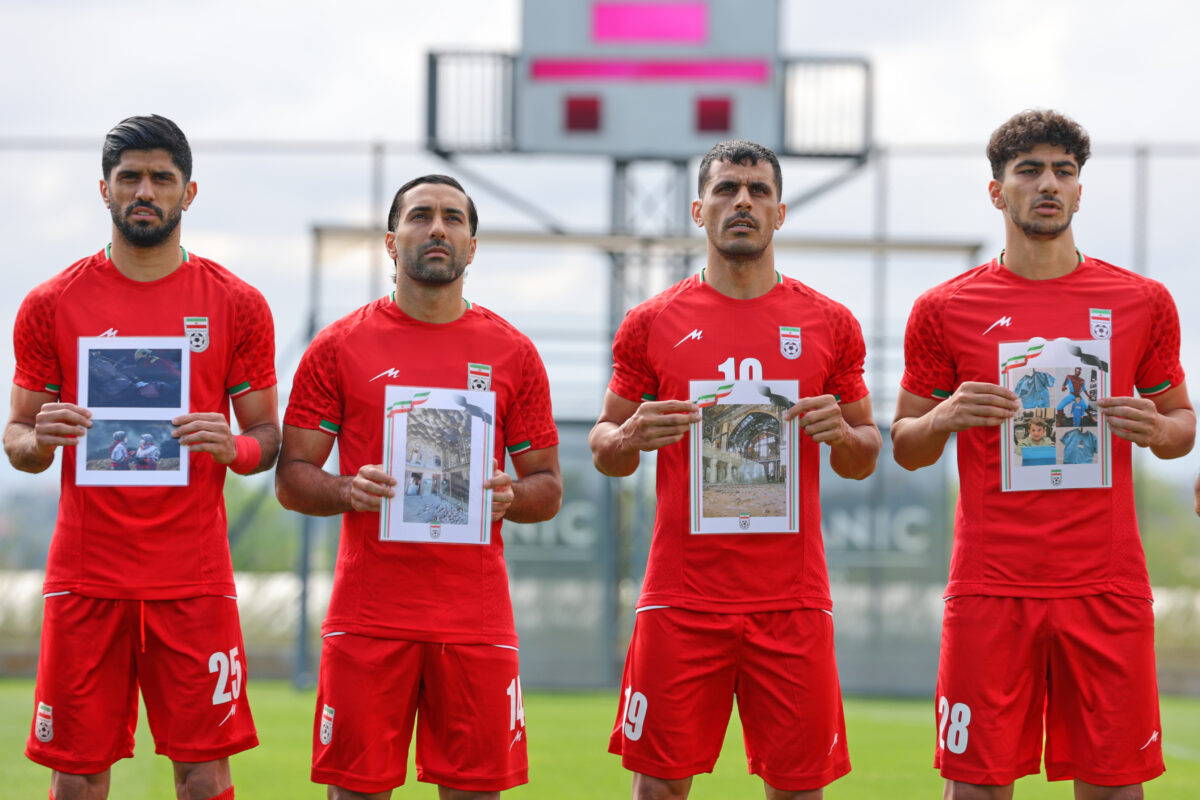 Football: Iranian players take to the pitch against Costa Rica with photos of children killed by bombs Football: Iranian players take to the pitch against Costa Rica with photos of children killed by bombs