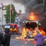 Northern Ireland, anti-migrant protests: buses and rubbish bins set alight in Belfast