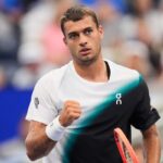 US Open: Cobolli comes from behind to beat Comesana and reach the second round