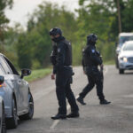United Kingdom: media reports that no explosives were found in vans at RAF base
